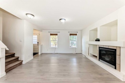715 Copperfield Boulevard Se, Calgary, AB - Indoor Photo Showing Living Room With Fireplace