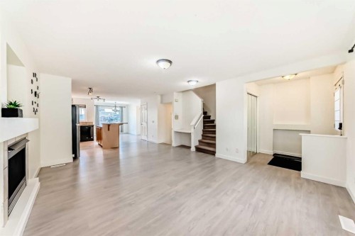 715 Copperfield Boulevard Se, Calgary, AB - Indoor Photo Showing Living Room With Fireplace