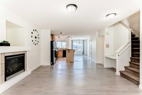 715 Copperfield Boulevard Se, Calgary, AB - Indoor Photo Showing Living Room With Fireplace