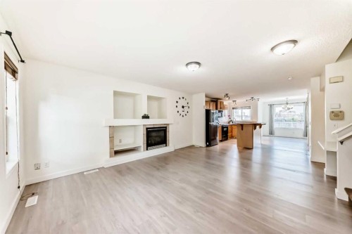 715 Copperfield Boulevard Se, Calgary, AB - Indoor Photo Showing Living Room With Fireplace