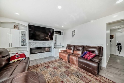 204 Coral Keys Green Ne, Calgary, AB - Indoor Photo Showing Living Room With Fireplace