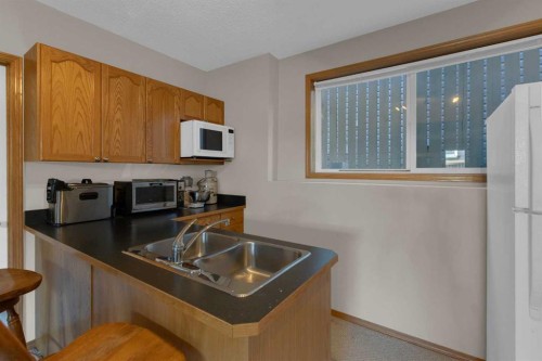 255 Panamount Lane Nw, Calgary, AB - Indoor Photo Showing Kitchen With Double Sink