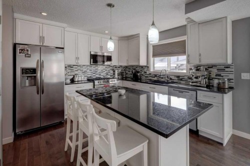 43 Canoe Square Sw, Airdrie, AB - Indoor Photo Showing Kitchen With Upgraded Kitchen