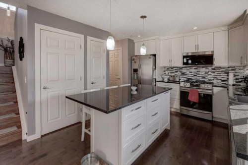43 Canoe Square Sw, Airdrie, AB - Indoor Photo Showing Kitchen With Upgraded Kitchen
