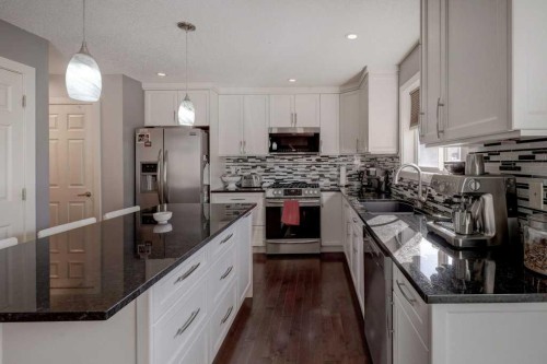43 Canoe Square Sw, Airdrie, AB - Indoor Photo Showing Kitchen With Upgraded Kitchen
