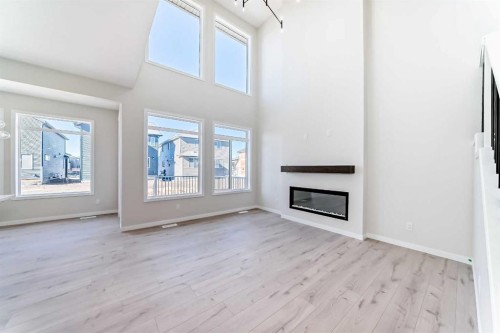 105 Corner Glen Green Ne, Calgary, AB - Indoor With Fireplace