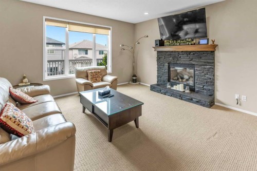 107 Everoak Green Sw, Calgary, AB - Indoor Photo Showing Living Room With Fireplace
