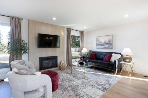 959 Parkwood Way Se, Calgary, AB - Indoor Photo Showing Living Room With Fireplace