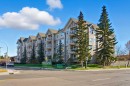103-128 Centre Avenue, Cochrane, AB  - Outdoor With Facade 