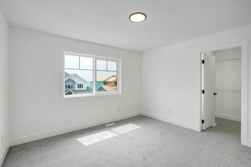 27 Heritage Close, Cochrane, AB - Indoor Photo Showing Other Room