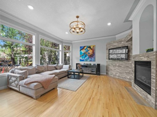 210 Evergreen Mews Sw, Calgary, AB - Indoor Photo Showing Living Room With Fireplace