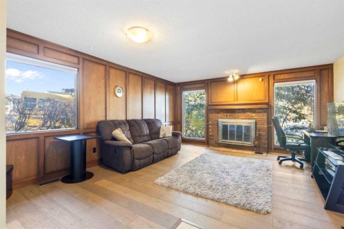 339 Ranchview Place Nw, Calgary, AB - Indoor Photo Showing Living Room With Fireplace