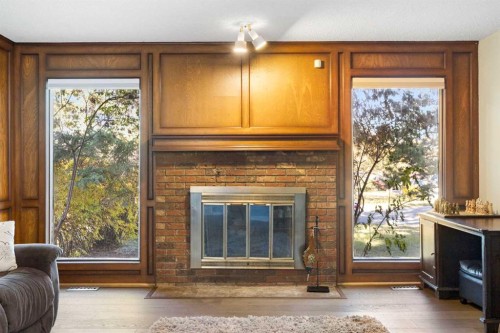 339 Ranchview Place Nw, Calgary, AB - Indoor Photo Showing Living Room With Fireplace