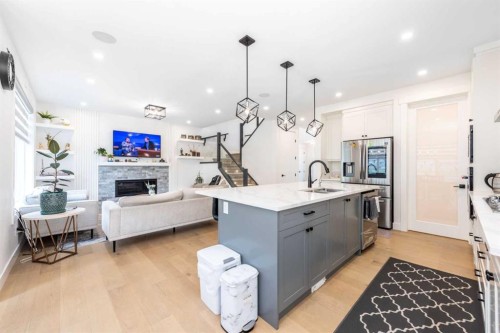53 Hampstead Mews Nw, Calgary, AB - Indoor Photo Showing Kitchen With Fireplace With Upgraded Kitchen