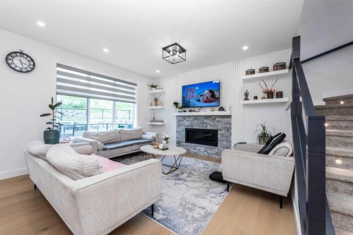 53 Hampstead Mews Nw, Calgary, AB - Indoor Photo Showing Living Room With Fireplace