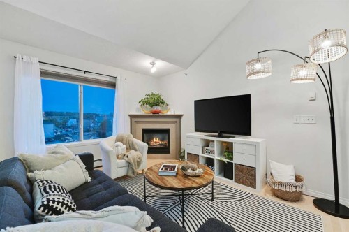 401-1110 17 Street Sw, Calgary, AB - Indoor Photo Showing Living Room With Fireplace