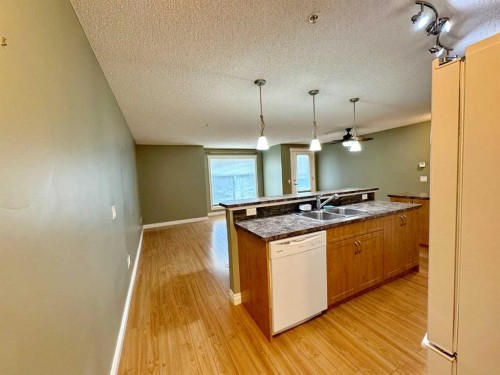 2126-700 Willowbrook Road Nw, Airdrie, AB - Indoor Photo Showing Kitchen With Double Sink