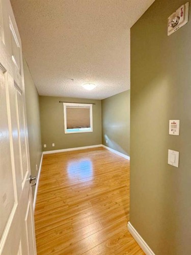 2126-700 Willowbrook Road Nw, Airdrie, AB - Indoor Photo Showing Other Room