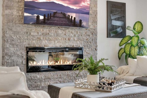 1315 Bayside Drive Sw, Airdrie, AB - Indoor With Fireplace