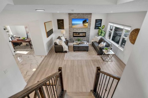 1315 Bayside Drive Sw, Airdrie, AB - Indoor With Fireplace