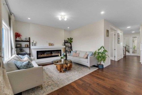 838 Edgefield Street, Strathmore, AB - Indoor Photo Showing Living Room With Fireplace