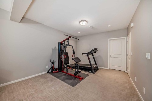 226 West Grove Point Sw, Calgary, AB - Indoor Photo Showing Gym Room