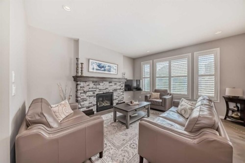 226 West Grove Point Sw, Calgary, AB - Indoor Photo Showing Living Room With Fireplace