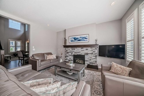 226 West Grove Point Sw, Calgary, AB - Indoor Photo Showing Living Room With Fireplace