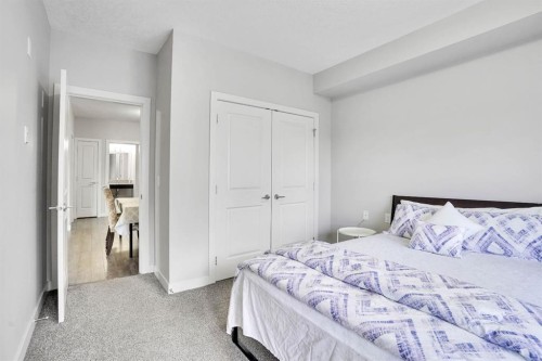 102-3 Taracove Estate Drive Ne, Calgary, AB - Indoor Photo Showing Bedroom
