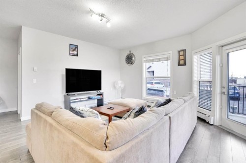 102-3 Taracove Estate Drive Ne, Calgary, AB - Indoor Photo Showing Living Room