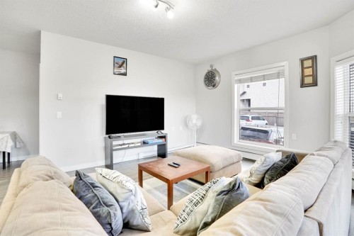 102-3 Taracove Estate Drive Ne, Calgary, AB - Indoor Photo Showing Living Room