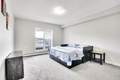 102-3 Taracove Estate Drive Ne, Calgary, AB - Indoor Photo Showing Bedroom
