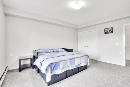 102-3 Taracove Estate Drive Ne, Calgary, AB - Indoor Photo Showing Bedroom