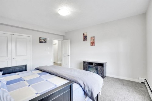 102-3 Taracove Estate Drive Ne, Calgary, AB - Indoor Photo Showing Bedroom