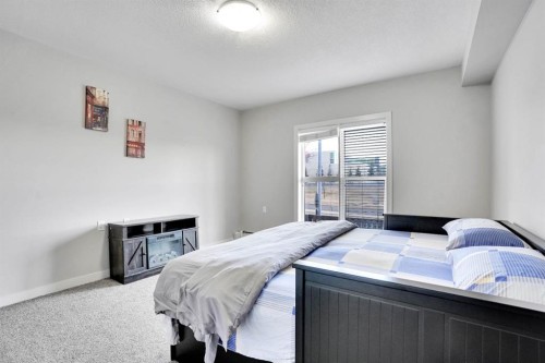 102-3 Taracove Estate Drive Ne, Calgary, AB - Indoor Photo Showing Bedroom