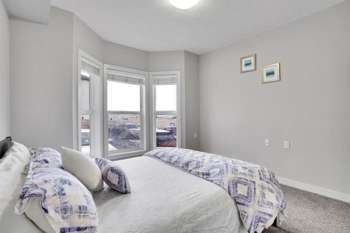 102-3 Taracove Estate Drive Ne, Calgary, AB - Indoor Photo Showing Bedroom