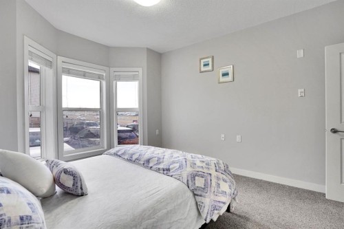 102-3 Taracove Estate Drive Ne, Calgary, AB - Indoor Photo Showing Bedroom