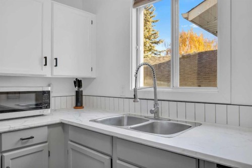 91 Shawglen Way Sw, Calgary, AB - Indoor Photo Showing Kitchen With Double Sink
