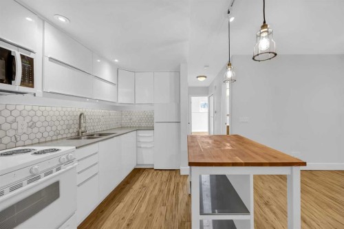 91 Shawglen Way Sw, Calgary, AB - Indoor Photo Showing Kitchen With Double Sink With Upgraded Kitchen