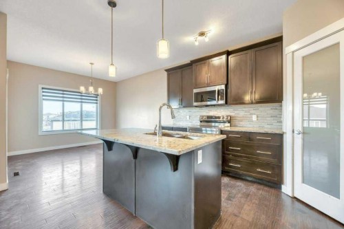 2450 Baysprings Link Sw, Airdrie, AB - Indoor Photo Showing Kitchen With Upgraded Kitchen