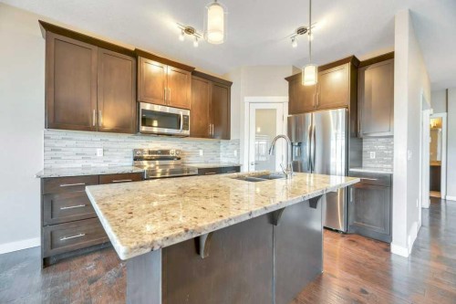 2450 Baysprings Link Sw, Airdrie, AB - Indoor Photo Showing Kitchen With Double Sink With Upgraded Kitchen