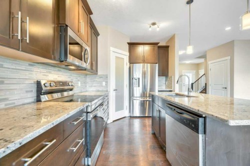 2450 Baysprings Link Sw, Airdrie, AB - Indoor Photo Showing Kitchen With Upgraded Kitchen