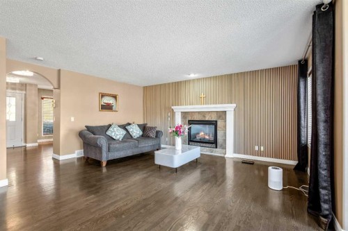 123 Cranwell Close Se, Calgary, AB - Indoor Photo Showing Living Room With Fireplace