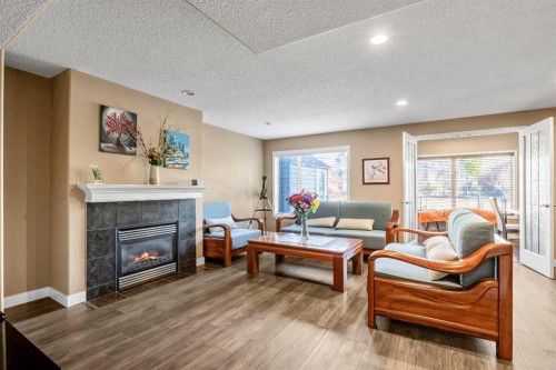 123 Cranwell Close Se, Calgary, AB - Indoor Photo Showing Living Room With Fireplace