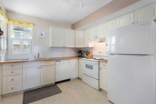 122 Bridlewood Lane Sw, Calgary, AB - Indoor Photo Showing Kitchen With Double Sink