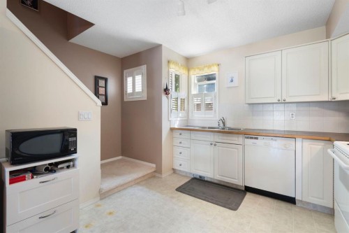 122 Bridlewood Lane Sw, Calgary, AB - Indoor Photo Showing Kitchen With Double Sink