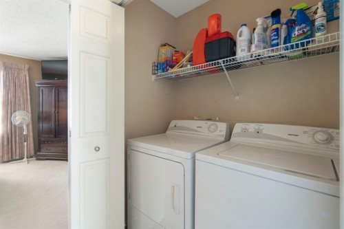 122 Bridlewood Lane Sw, Calgary, AB - Indoor Photo Showing Laundry Room