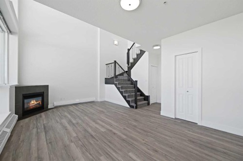 2404-77 Spruce Place Sw, Calgary, AB - Indoor With Fireplace