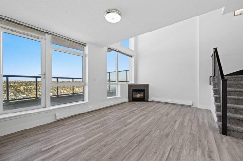 2404-77 Spruce Place Sw, Calgary, AB - Indoor With Fireplace