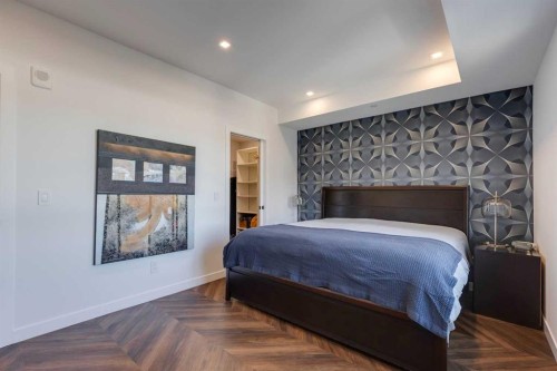 501-8505 Broadcast Avenue Sw, Calgary, AB - Indoor Photo Showing Bedroom With Fireplace